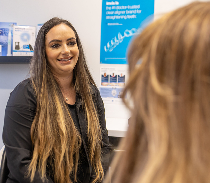 Orlando dentist talking to a patient in the treatment chair