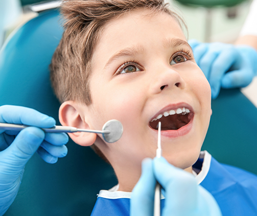 Young boy receiving a dental exam