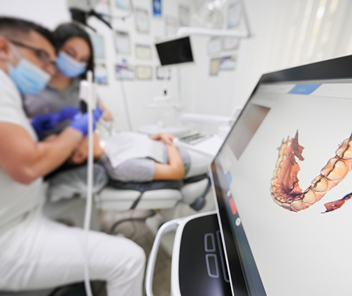 Dentist capturing digital impressions of a patient's teeth
