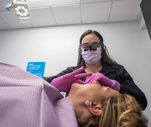 Dentist examining a patient's teeth