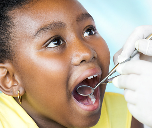 Child receiving a dental exam